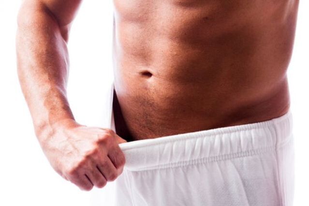 a man assessing the size of his penis
